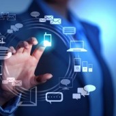 Business person pushing symbols on a touch screen interface